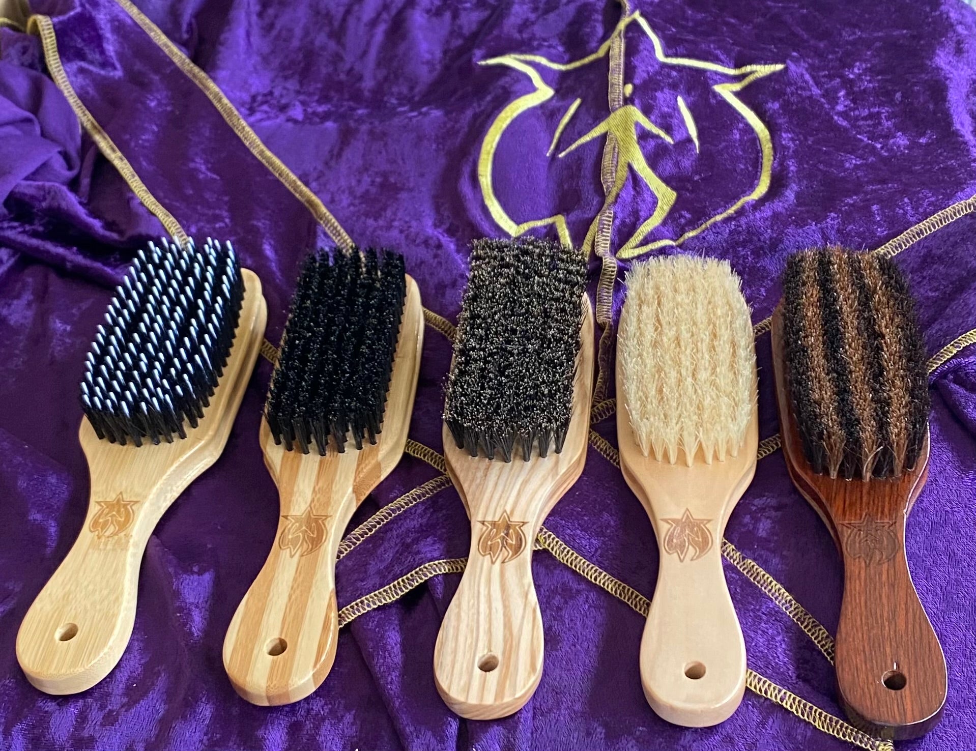 Five Surefire Youth wave brushes displayed on a purple Surefire backdrop