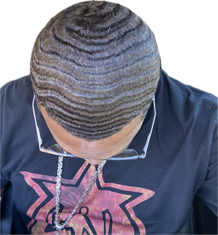 Surefire Youth community member in a branded shirt showing his waves